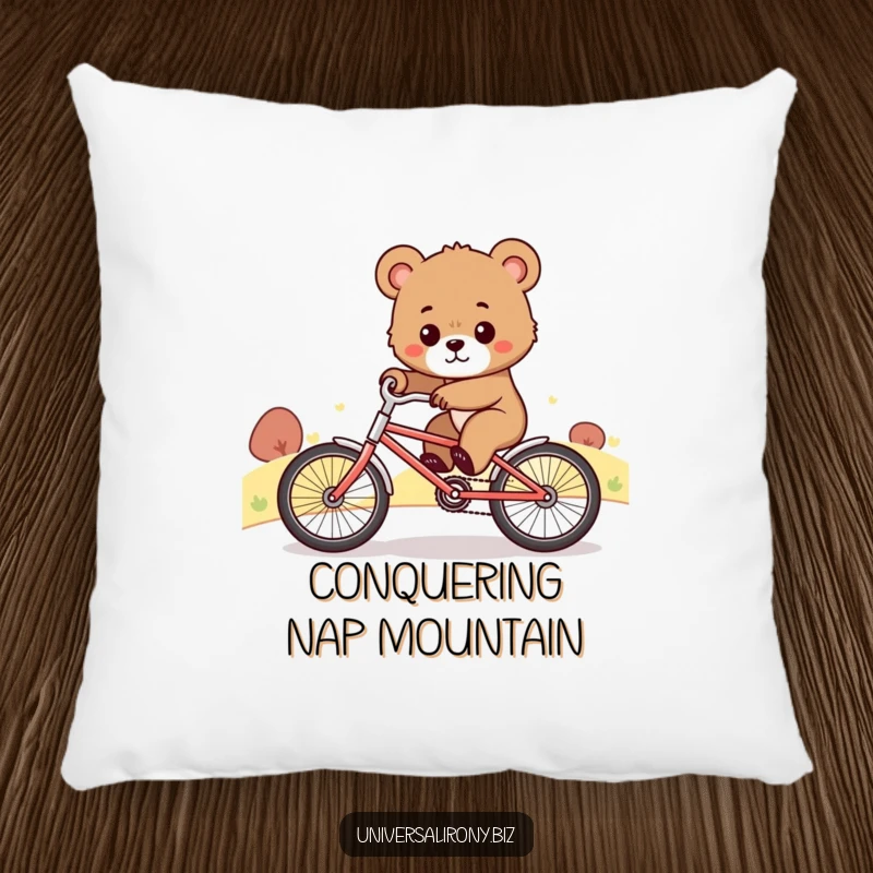 Funny pillow illustrating a cute, determined bear cub comically riding a tiny bicycle uphill, symbolizing striving and resilience.