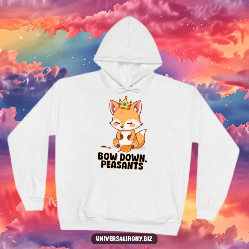 Funny kawaii fox wearing a crown, looking smugly at a leaf, featured on a warm hoodie for regal relaxation.